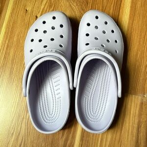 Women’s purple crocs size 10. They are used but still lots of life left.
